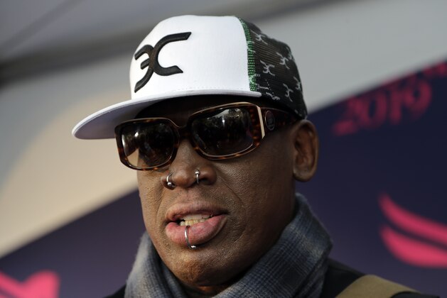 FILE - In this Jan. 26, 2019, file photo, retired NBA basketball player Dennis Rodman is interviewed on the blue carpet at the Pegasus World Cup Invitational Horse Race at Gulfstream Park in Hallandale Beach, Fla. Rodman is pleading not guilty after he was charged with a misdemeanor for slapping a man who was celebrating the former NBA star’s birthday at a Florida bar. Rodman’s attorney Lorne Berkeley denies the accusation and says an investigation will exonerate the retired player. (AP Photo/Lynne Sladky)