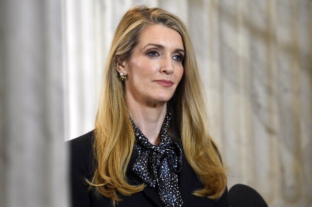 Sen. Kelly Loeffler, R-Ga., waits to speak in a television interview on Capitol Hill in Washington, Friday, March 20, 2020. (AP Photo/Susan Walsh)