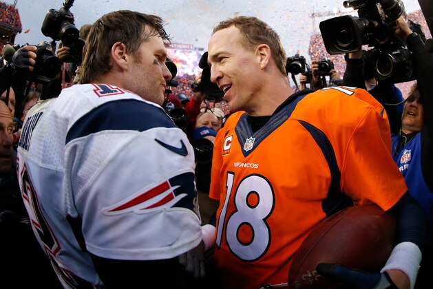 DENVER, CO - JANUARY 24:  Peyton Manning #18 of the Denver Broncos and Tom Brady #12 of the New England Patriots speak after the AFC Championship game at Sports Authority Field at Mile High on January 24, 2016 in Denver, Colorado. The Broncos defeated the Patriots 20-18.  (Photo by Ezra Shaw/Getty Images)