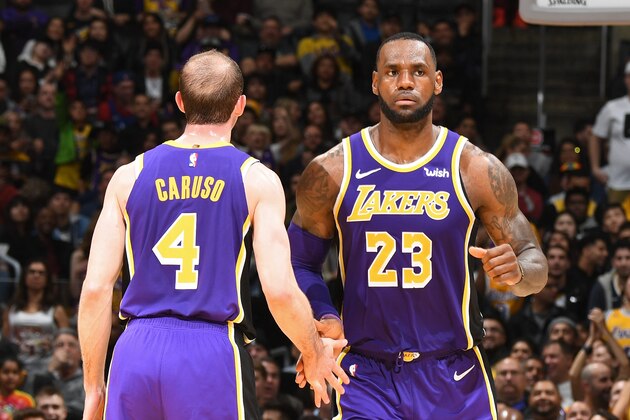 LOS ANGELES, CA - MARCH 6: Alex Caruso #4 and LeBron James #23 of the Los Angeles Lakers high five during the game against the Denver Nuggets on March 6 2019 at STAPLES Center in Los Angeles, California. NOTE TO USER: User expressly acknowledges and agrees that, by downloading and/or using this photograph, user is consenting to the terms and conditions of the Getty Images License Agreement. Mandatory Copyright Notice: Copyright 2019 NBAE (Photo by Andrew D. Bernstein/NBAE via Getty Images)