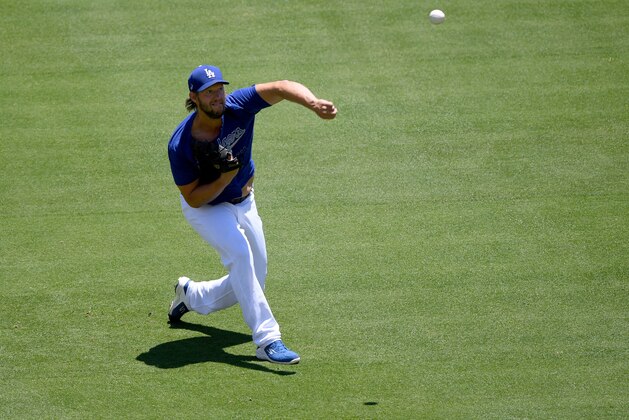 LOS ANGELES, CALIFORNIA - JULY 03:  Clayton Kershaw #22 of the Los Angeles Dodgers throws at a summer workout in preparation for a shortened season during the coronavirus (COVID-19) pandemic at Dodger Stadium on July 03, 2020 in Los Angeles, California. (Photo by Harry How/Getty Images)