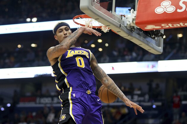 Los Angeles Lakers forward Kyle Kuzma (0) dunks the ball in the first half of an NBA basketball game in New Orleans, Sunday, March 1, 2020. (AP Photo/Rusty Costanza)