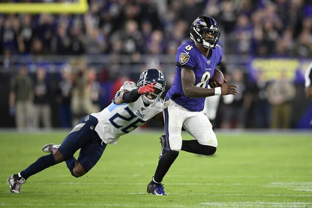Baltimore Ravens quarterback Lamar Jackson (8) runs with the ball during the second half an NFL divisional playoff football game against Tennessee Titans cornerback Logan Ryan (26), Saturday, Jan. 11, 2020, in Baltimore. (AP Photo/Nick Wass)