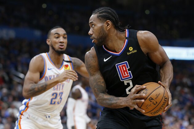 Los Angeles Clippers' Kawhi Leonard (2) goes against Oklahoma City Thunder's Terrance Ferguson (23) during the first half of an NBA basketball game in Oklahoma City, Tuesday, March, 3, 2020. (AP Photo/Garett Fisbeck)
