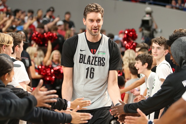 PORTLAND, OR - OCTOBER 6: Pau Gasol #16 of the Portland Trail Blazers hi-fives fans during the team's annual