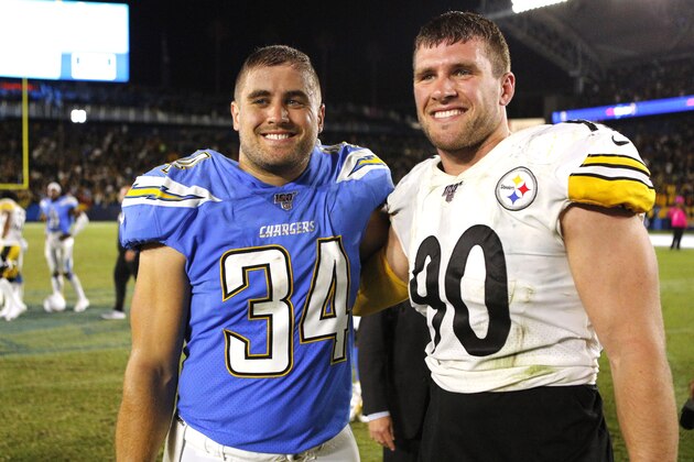 CARSON, CALIFORNIA - OCTOBER 13:  Brothers Derek Watt #34 of the Los Angeles Chargers and T.J. Watt #90 of the Pittsburgh Steelers pose for a photo following a game at Dignity Health Sports Park on October 13, 2019 in Carson, California. (Photo by Katharine Lotze/Getty Images)