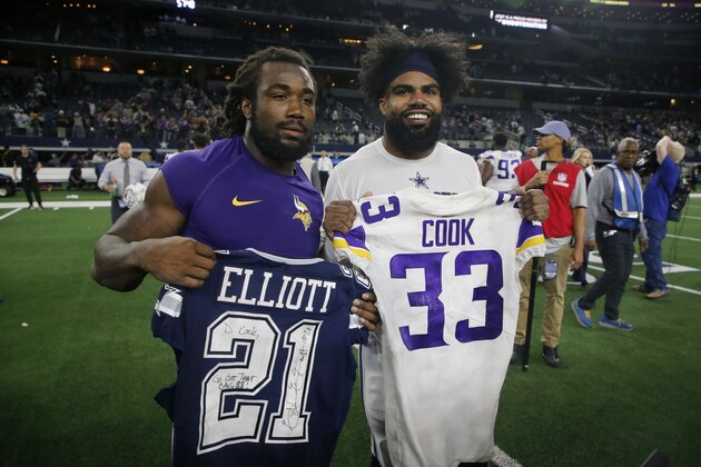 Minnesota Vikings' Dalvin Cook, left, and Dallas Cowboys' Ezekiel Elliott, right, swap jerseys after their NFL football game in Arlington, Texas, Sunday, Nov. 10, 2019. (AP Photo/Michael Ainsworth)