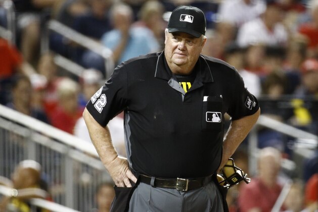 FILE- In this Sept. 27, 2019, file photo, umpire Joe West stands on the field during a baseball game between the Cleveland Indians and the Washington Nationals in Washington. West has sued retired player Paul LoDuca for defamation after the former catcher alleged West gave pitcher Bill Wagner a bigger strike zone in exchange for letting the umpire borrow a vintage car. (AP Photo/Patrick Semansky, File) FILE- In this Sept. 27, 2019, file photo, umpire Joe West stands on the field during a baseball game between the Cleveland Indians and the Washington Nationals in Washington. West has sued retired player Paul LoDuca for defamation after the former catcher alleged West gave pitcher Bill Wagner a bigger strike zone in exchange for letting the umpire borrow a vintage car. (AP Photo/Patrick Semansky, File)