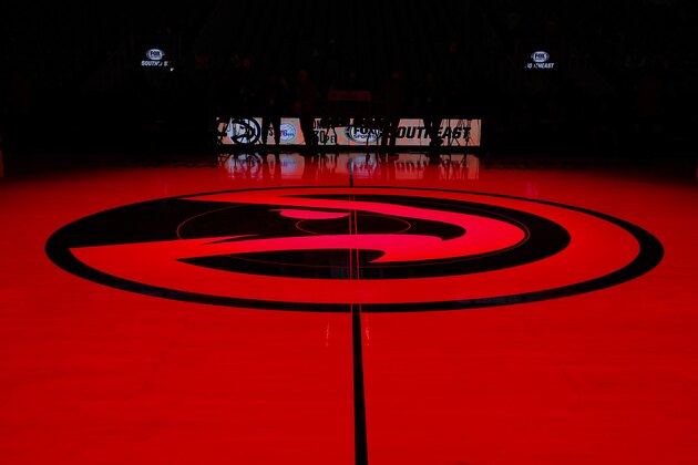 ATLANTA, GA - FEBRUARY 22: The Atlanta Hawks logo at mid court is lit in red prior to an NBA game against the Dallas Mavericks at State Farm Arena on February 22, 2020 in Atlanta, Georgia. NOTE TO USER: User expressly acknowledges and agrees that, by downloading and/or using this photograph, user is consenting to the terms and conditions of the Getty Images License Agreement. (Photo by Todd Kirkland/Getty Images)
