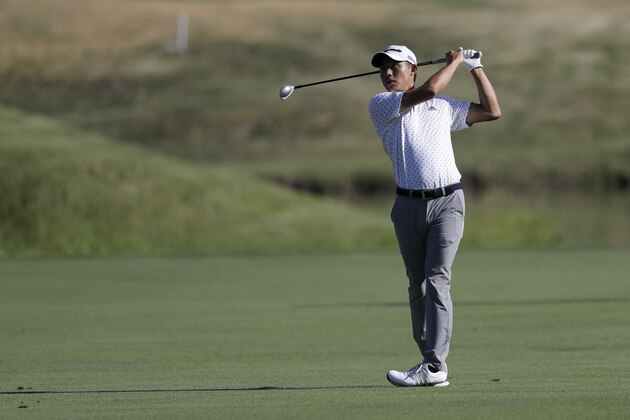 Collin Morikawa hits from the 13th hole fairway during the second round of the Travelers Championship golf tournament at TPC River Highlands, Friday, June 26, 2020, in Cromwell, Conn. (AP Photo/Frank Franklin II)