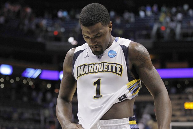 Marquette's Darius Johnson-Odom (1) walks off the court after his team went down to Florida 68-58 in a NCAA tournament West Regional semifinal college basketball game Thursday, March 22, 2012, in Phoenix. (AP Photo/Chris Carlson)
