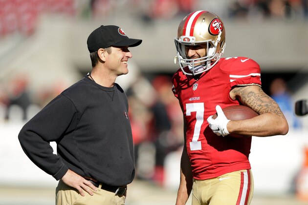 SANTA CLARA, CA - DECEMBER 28:  Head coach Jim Harbaugh of the San Francisco 49ers talks with Colin Kaepernick #7 before their game against the Arizona Cardinals at Levi's Stadium on December 28, 2014 in Santa Clara, California.  (Photo by Ezra Shaw/Getty Images)