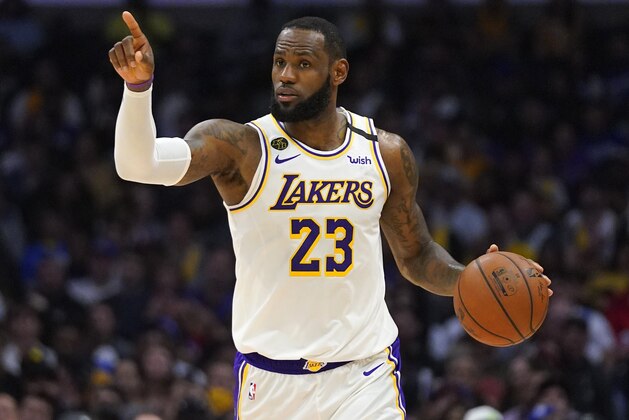 Los Angeles Lakers forward LeBron James gestures during the second half of an NBA basketball game against the Los Angeles Clippers Sunday, March 8, 2020, in Los Angeles. The Lakers won 112-103. (AP Photo/Mark J. Terrill)