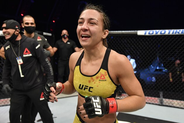 ABU DHABI, UNITED ARAB EMIRATES - JULY 12: In this handout image provided by UFC, Amanda Ribas of Brazil celebrates after her victory over Paige VanZant in their flyweight fight during the UFC 251 event at Flash Forum on UFC Fight Island on July 12, 2020 on Yas Island, Abu Dhabi, United Arab Emirates. (Photo by Jeff Bottari/Zuffa LLC via Getty Images)