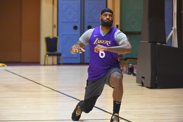 ORLANDO, FL - JULY 11: LeBron James of the Los Angeles Lakers stretches during practice as part of the NBA Restart 2020 on July 11, 2020 in Orlando, Florida. NOTE TO USER: User expressly acknowledges and agrees that, by downloading and/or using this photograph, user is consenting to the terms and conditions of the Getty Images License Agreement. Mandatory Copyright Notice: Copyright 2020 NBAE (Photo by Bill Baptist/NBAE via Getty Images) ORLANDO, FL - JULY 11: LeBron James of the Los Angeles Lakers stretches during practice as part of the NBA Restart 2020 on July 11, 2020 in Orlando, Florida. NOTE TO USER: User expressly acknowledges and agrees that, by downloading and/or using this photograph, user is consenting to the terms and conditions of the Getty Images License Agreement. Mandatory Copyright Notice: Copyright 2020 NBAE (Photo by Bill Baptist/NBAE via Getty Images)