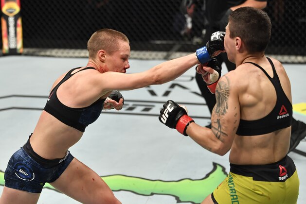 ABU DHABI, UNITED ARAB EMIRATES - JULY 12: (L-R) Rose Namajunas punches Jessica Andrade of Brazil in their strawweight fight during the UFC 251 event at Flash Forum on UFC Fight Island on July 12, 2020 on Yas Island, Abu Dhabi, United Arab Emirates. (Photo by Jeff Bottari/Zuffa LLC)