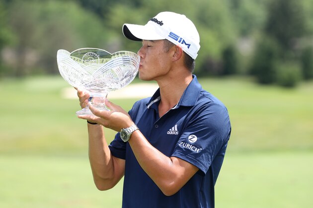 DUBLIN, OHIO - JULY 12: Collin Morikawa of the United States celebrates with the winner's trophy after the final round of the Workday Charity Open on July 12, 2020 at Muirfield Village Golf Club in Dublin, Ohio. (Photo by Gregory Shamus/Getty Images)