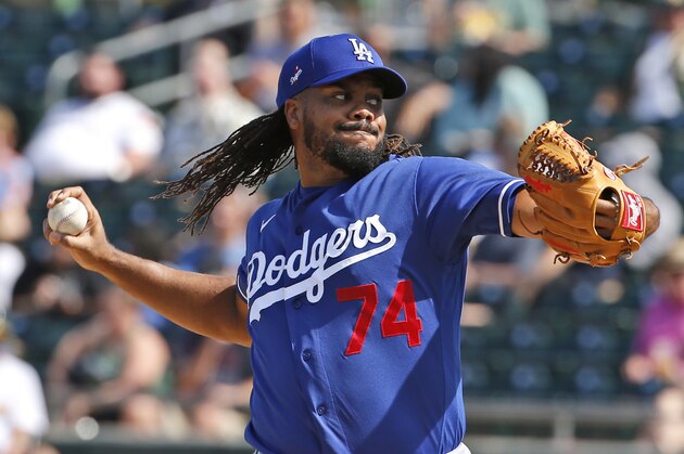 Los Angeles Dodgers' Kenley Jansen (74) pitches during a spring training baseball game, Thursday, March 5, 2020, in Mesa, Ariz. (AP Photo/Sue Ogrocki)