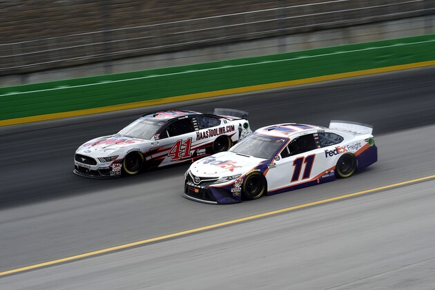 SPARTA, KENTUCKY - JULY 12: Denny Hamlin, driver of the #11 FedEx Freight Toyota, races Cole Custer, driver of the #41 HaasTooling.com Ford, during the NASCAR Cup Series Quaker State 400 Presented by Walmart at Kentucky Speedway on July 12, 2020 in Sparta, Kentucky. (Photo by Jared C. Tilton/Getty Images)