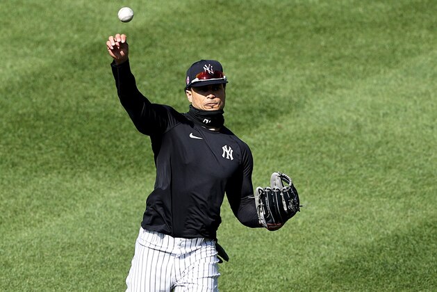 NEW YORK, NEW YORK - JULY 04: Giancarlo Stanton #27 of the New York Yankees warms up in the outfield during summer workouts at Yankee Stadium on July 04, 2020 in the Bronx borough of New York City. (Photo by Elsa/Getty Images)