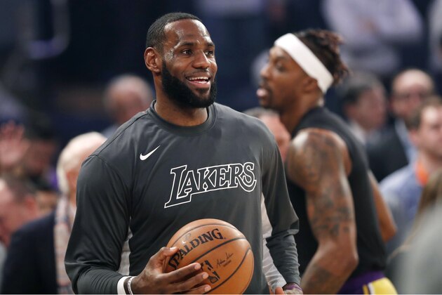 Los Angeles Lakers forward LeBron James, left, and Dwight Howard during pregame warmups before an NBA basketball gameagainst the New York Knicks in New York, Wednesday, Jan. 22, 2020. (AP Photo/Kathy Willens)