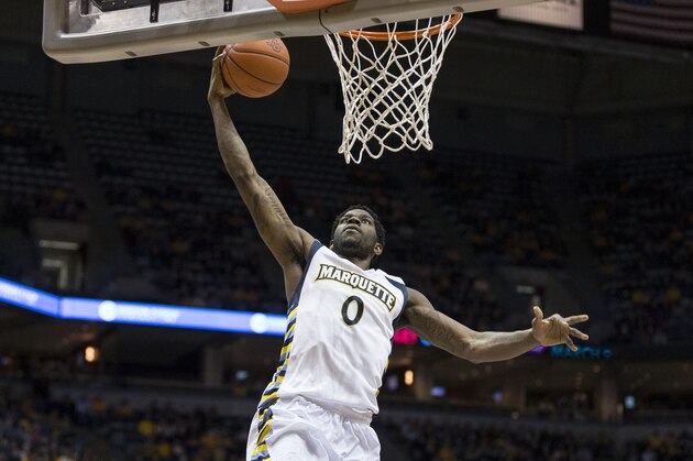 Marquette's Jamil Wilson drives in for a dunk against DePaul during the first half of an NCAA college basketball game Saturday, Jan. 4, 2014, in Milwaukee. (AP Photo/Tom Lynn)