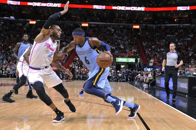 Memphis Grizzlies guard Mario Chalmers (6) drives to the basket past Miami Heat guard Wayne Ellington (2) during the first half of an NBA basketball game Saturday, Feb. 24, 2018. (AP Photo/Gaston De Cardenas)