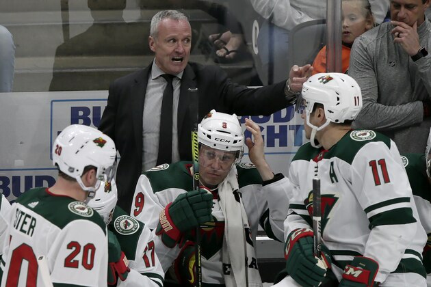 Minnesota Wild interim head coach Dean Evason, above center, directs players behind the bench during the overtime period of an NHL hockey game against the Anaheim Ducks in Anaheim, Calif., Sunday, March 8, 2020. (AP Photo/Alex Gallardo) Minnesota Wild interim head coach Dean Evason, above center, directs players behind the bench during the overtime period of an NHL hockey game against the Anaheim Ducks in Anaheim, Calif., Sunday, March 8, 2020. (AP Photo/Alex Gallardo)