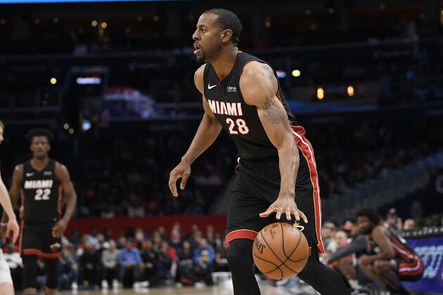 Miami Heat guard Andre Iguodala (28) dribbles the ball during the first half of an NBA basketball game against the Washington Wizards, Sunday, March 8, 2020, in Washington. (AP Photo/Nick Wass)