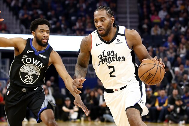 SAN FRANCISCO, CALIFORNIA - MARCH 10:   Kawhi Leonard #2 of the LA Clippers dribbles past Chasson Randle #25 of the Golden State Warriors at Chase Center on March 10, 2020 in San Francisco, California. NOTE TO USER: User expressly acknowledges and agrees that, by downloading and or using this photograph, User is consenting to the terms and conditions of the Getty Images License Agreement.  (Photo by Ezra Shaw/Getty Images)