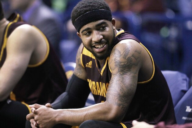 FILE - In this Friday, Feb. 24, 2017, file photo, Central Michigan guard Marcus Keene talks to a teammate on the bench during an NCAA college basketball game against Toledo in Toledo, Ohio. A person familiar with the decision tells The Associated Press the nation's leading scorer, Keene, is entering the NBA Draft. (AP Photo/Carlos Osorio, File)