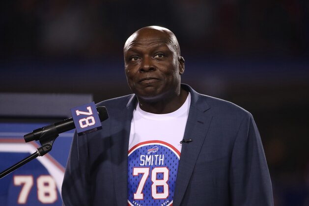 ORCHARD PARK, NY - SEPTEMBER 15: Former player and Hall of Fame member Bruce Smith #78 of the Buffalo Bills speaks during a half-time ceremony in which his number is retired during NFL game action against the New York Jets at New Era Field on September 15, 2016 in Orchard Park, New York. (Photo by Tom Szczerbowski/Getty Images)
