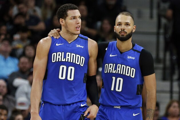 SAN ANTONIO, TX - FEBRUARY 29:  Aaron Gordon #00 of the Orlando Magic is comforted by teammate Evan Fournier #10 after he was called for a foul during s second half action at AT&T Center on February  29, 2020 in San Antonio, Texas.  San Antonio Spurs defeated the Orlando Magic 114-113. NOTE TO USER: User expressly acknowledges and agrees that , by downloading and or using this photograph, User is consenting to the terms and conditions of the Getty Images License Agreement. (Photo by Ronald Cortes/Getty Images)