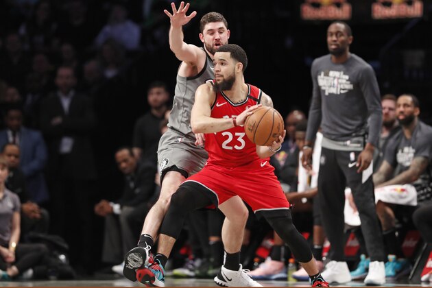 Brooklyn Nets forward Joe Harris defends Toronto Raptors guard Fred VanVleet (23) during the second half of an NBA basketball game, Wednesday, Feb. 12, 2020, in New York.The Nets defeated te Raptors 101-91. (AP Photo/Kathy Willens)
