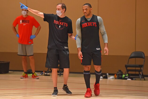 ORLANDO, FL - JULY 13: Brett Gunning coaches Eric Gordon #10 of the Houston Rockets during practice as part of the NBA Restart 2020 on July 13, 2020 in Orlando, Florida. NOTE TO USER: User expressly acknowledges and agrees that, by downloading and/or using this photograph, user is consenting to the terms and conditions of the Getty Images License Agreement.  Mandatory Copyright Notice: Copyright 2020 NBAE (Photo by Bill Baptist/NBAE via Getty Images)