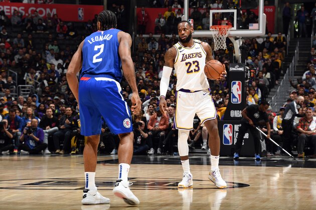 LOS ANGELES, CA - MARCH 8: Kawhi Leonard #2 of the LA Clippers plays defense while LeBron James #23 of the Los Angeles Lakers handles the ball on March 8, 2020 at STAPLES Center in Los Angeles, California. NOTE TO USER: User expressly acknowledges and agrees that, by downloading and/or using this Photograph, user is consenting to the terms and conditions of the Getty Images License Agreement. Mandatory Copyright Notice: Copyright 2020 NBAE (Photo by Andrew D. Bernstein/NBAE via Getty Images) LOS ANGELES, CA - MARCH 8: Kawhi Leonard #2 of the LA Clippers plays defense while LeBron James #23 of the Los Angeles Lakers handles the ball on March 8, 2020 at STAPLES Center in Los Angeles, California. NOTE TO USER: User expressly acknowledges and agrees that, by downloading and/or using this Photograph, user is consenting to the terms and conditions of the Getty Images License Agreement. Mandatory Copyright Notice: Copyright 2020 NBAE (Photo by Andrew D. Bernstein/NBAE via Getty Images)
