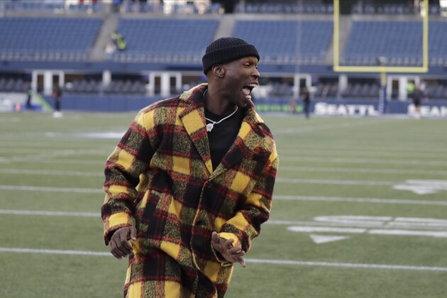 Former NFL player Chad Ochocinco runs on the field before an NFL football game between the Seattle Seahawks and the San Francisco 49ers an NFL football game, Sunday, Dec. 29, 2019, in Seattle. (AP Photo/Ted S. Warren)