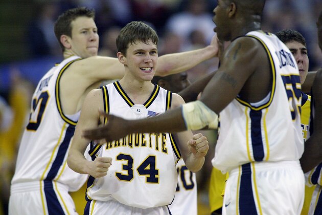 INDIANAPOLIS - MARCH 22:  Travis Diener #34 of Marquett celebrates with his teammates during the NCAA Tournament against University of Missouri on March 22, 2003 at the RCA Dome in Indianapolis, Indiana. Marquette defeated Missouri 101-92 in overtime. (Photo by Jonathan Daniel/Getty Images)