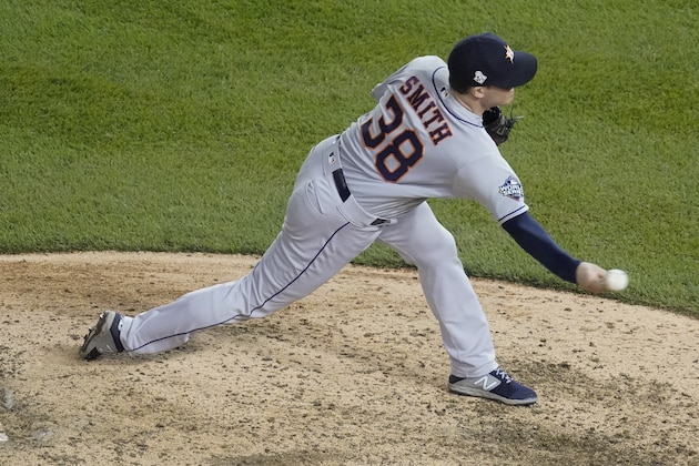 Houston Astros relief pitcher Joe Smith throws during the eighth inning of Game 5 of the baseball World Series against the Washington Nationals Sunday, Oct. 27, 2019, in Washington. (AP Photo/Pablo Martinez Monsivais)