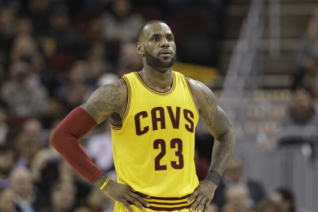 FILE - In this Jan. 25, 2017 file photo, Cleveland Cavaliers' LeBron James waits during a timeout in the first half of the team's NBA basketball game against the Sacramento Kings in Cleveland. After James was criticized by Charles Barkley for questioning Cleveland’s front office, James tore into the former NBA star and opinionated TV commentator on Monday, Jan. 30,  following a loss in Dallas.  (AP Photo/Tony Dejak)