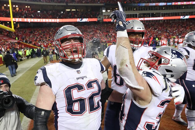 KANSAS CITY, MISSOURI - JANUARY 20:  Rex Burkhead #34 of the New England Patriots celebrates with nn62#2after scoring the game-winning touchdown to defeat the Kansas City Chiefs in overtime during the AFC Championship Game at Arrowhead Stadium on January 20, 2019 in Kansas City, Missouri. The Patriots defeated the Chiefs 37-31. (Photo by Patrick Smith/Getty Images)