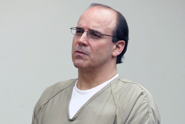 In this Thursday, Sept 15, 2011 file photo, Former Ohio State and NFL quarterback Art Schlichter listens as Judge Timothy Horton reads him his sentence in Franklin County Common Pleas Court in Columbus, Ohio. The government is going after retirement funds for Schlichter, an ex-Ohio State and NFL quarterback who’s serving prison time for scamming participants in a million-dollar sports ticket scheme.  (AP Photo/Terry Gilliam, File)