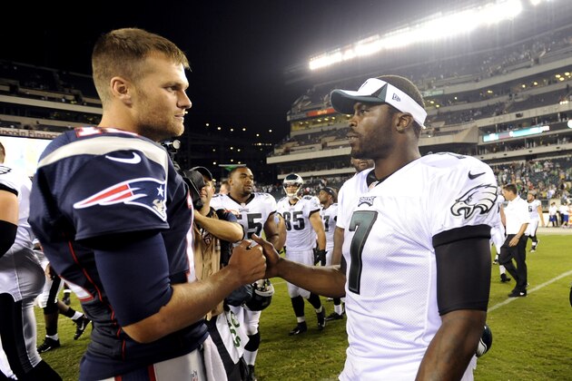 New England Patriots quarterback Tom Brady, left, and Philadelphia Eagles quarterback Michael Vick meet after a preseason NFL football game on Friday, Aug. 9, 2013, in Philadelphia. New England won 31-22. (AP Photo/Michael Perez)