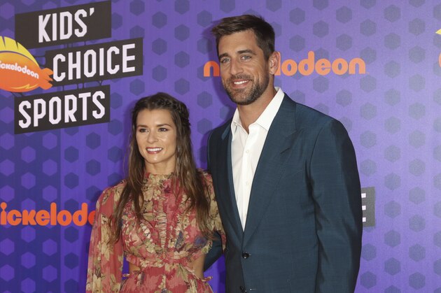 NFL football player Aaron Rodgers, of the Green Bay Packers, right, and Danica Patrick arrive at the Kids' Choice Sports Awards at the Barker Hangar on Thursday, July 19, 2018, in Santa Monica, Calif. (Photo by Willy Sanjuan/Invision/AP)