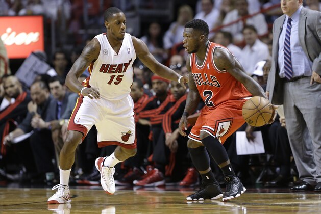 Chicago Bulls' Nate Robinson (2) drives to the basket as Miami Heat's Mario Chalmers (15)during the first half of Game 2 of the NBA basketball playoff series in the Eastern Conference semifinals, Wednesday, May 8, 2013 in Miami. (AP Photo/Lynne Sladky) Chicago Bulls' Nate Robinson (2) drives to the basket as Miami Heat's Mario Chalmers (15)during the first half of Game 2 of the NBA basketball playoff series in the Eastern Conference semifinals, Wednesday, May 8, 2013 in Miami. (AP Photo/Lynne Sladky)