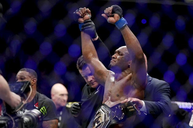 Kamaru Usman celebrates after his win against Tyron Woodley in a welterweight mixed martial arts title fight at UFC 235, Saturday, March 2, 2019, in Las Vegas. (AP Photo/John Locher)