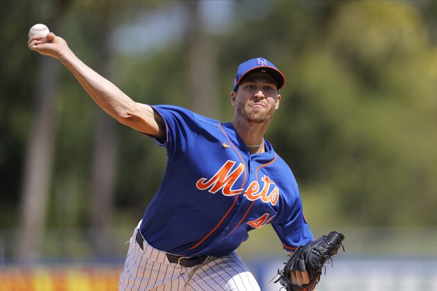 New York Mets pitcher Jacob deGrom warms up prior to a spring training baseball game against the St. Louis Cardinals, Wednesday, March 11, 2020, in Port S. Lucie, Fla. (AP Photo/Julio Cortez)