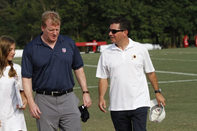 NFL commissioner Roger Goodell, left, talks with Washington Redskins owner Daniel Snyder, right, after the NFL football team's training camp at Redskins Park, Wednesday, Aug. 4, 2010, in Ashburn, Va.(AP Photo/Rob Carr)