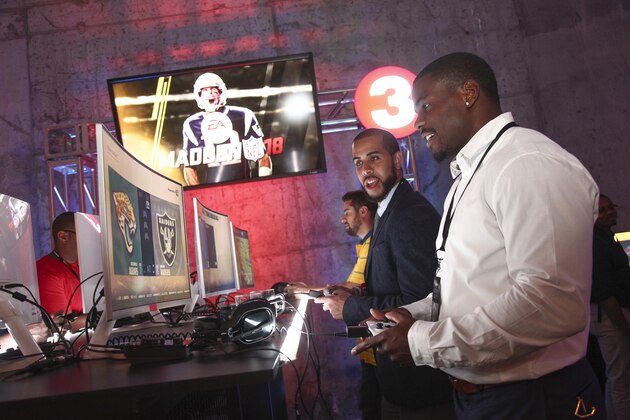 IMAGE DISTRIBUTED FOR NFL - Participants are seen at Madden at Midnight, the official celebration of the release of Madden NFL 18, at Skylight Modern on Thursday, Aug. 25, 2017 in New York. (Andy Kropa/AP Images for NFL)