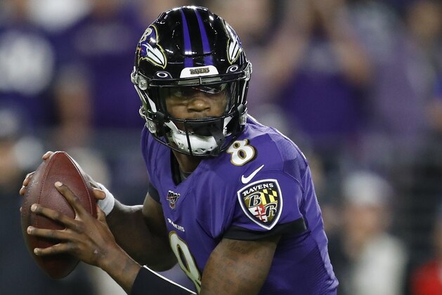 Baltimore Ravens quarterback Lamar Jackson (8) runs out of the pocket against the Tennessee Titans during the first half an NFL divisional playoff football game, Saturday, Jan. 11, 2020, in Baltimore. (AP Photo/Julio Cortez)